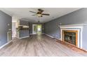 Living room with fireplace, hardwood floors, and open concept at 215 Cantilever Ct, Summerville, SC 29486