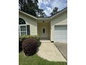 House entrance with walkway and lush green shrubs at 422 Constance St, Walterboro, SC 29488
