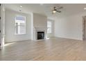 Spacious living room featuring hardwood floors and fireplace at 2193 Blue Bayou Blvd, Johns Island, SC 29455