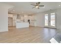 Open concept kitchen with white cabinets and island at 2193 Blue Bayou Blvd, Johns Island, SC 29455