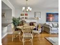 Cozy dining area with hardwood floors and a glass-top table at 1309 Pelican Watch Villas, Seabrook Island, SC 29455