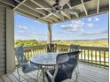 Deck with table and chairs offering scenic water views at 1309 Pelican Watch Villas, Seabrook Island, SC 29455