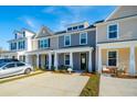 Townhouses with front porches and driveways at 205 Abercom Place Dr, Moncks Corner, SC 29461