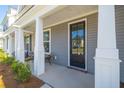 Charming front porch with seating area at 205 Abercom Place Dr, Moncks Corner, SC 29461