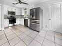 Bright kitchen featuring stainless steel appliances and tile floor at 219 Owens Dr, Summerville, SC 29485