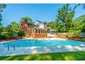 Inviting backyard pool with large brick home at 181 Pekoe Ct, Summerville, SC 29483