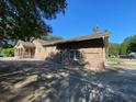 Brick house with a detached garage and large yard at 1229 Central Ave, Summerville, SC 29483