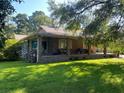 Brick ranch house with a large backyard and trees at 1229 Central Ave, Summerville, SC 29483