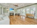 Spacious living room with hardwood floors, fireplace, and built-in shelving at 775 Navigators Run, Mount Pleasant, SC 29464