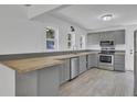 Modern gray kitchen with stainless steel appliances and a wood countertop at 1586 Highway 15, Saint George, SC 29477