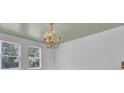 Bright dining room with a chandelier and wood-look flooring at 1586 Highway 15, Saint George, SC 29477