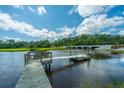 Wooden dock with access ramp over calm water at 8083 Point Of Pines Rd, Edisto Island, SC 29438