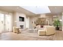 Spacious living room with a curved sofa, fireplace, and large windows at 284 Meeting St # 203, Charleston, SC 29401