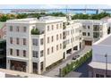 Exterior view of the building, showcasing its architectural details and private parking at 284 Meeting St # 303, Charleston, SC 29401