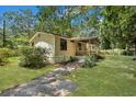 Single wide mobile home with side yard and mature trees at 137 Thelma Dr, Summerville, SC 29485