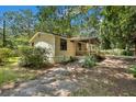 Single wide mobile home with side yard and mature trees at 137 Thelma Dr, Summerville, SC 29485