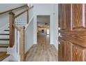 Open entryway with hardwood floors, stairs, and a view of the living area at 427 Grove End Rd, Moncks Corner, SC 29461