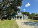 Newly built gray house on a grassy lot at 102 Whitesville Rd, Moncks Corner, SC 29461