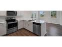 Modern kitchen with island and stainless steel appliances at 426 Grove End Rd, Moncks Corner, SC 29461