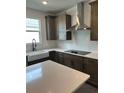 Modern kitchen with stainless steel appliances at 741 Blue Iris Way, Summerville, SC 29486