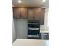 Double oven and modern gray kitchen cabinets at 741 Blue Iris Way, Summerville, SC 29486