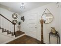 Inviting entryway with staircase, wood floors, and decorative accents at 5 Avon Ct, Charleston, SC 29407