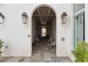 Building entrance with arched walkways, seating, and lanterns at 301 Longshore St # 441, Charleston, SC 29492