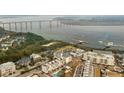 Aerial view of waterfront community with homes and a bridge at 301 Longshore St # 441, Charleston, SC 29492