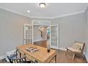 Cozy home office with built-in desk and French doors at 361 Wappoo Trace Ln, Summerville, SC 29486