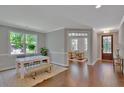 Light-filled dining area with a white table and bench at 361 Wappoo Trace Ln, Summerville, SC 29486
