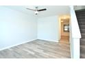 Spacious living room with neutral walls, wood-look flooring, and ceiling fan at 1910 Tropicana Rd # 9-B, North Charleston, SC 29406