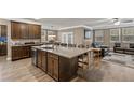 Spacious kitchen with large island, granite countertops, and dark wood cabinets at 316 Bay Village Ln, Moncks Corner, SC 29461