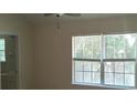 Bright bedroom with large window and ceiling fan at 258 Kelsey Blvd, Wando, SC 29492