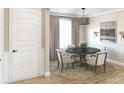 Formal dining room with round table and neutral decor at 1668 Siloh Dr # 470, Mount Pleasant, SC 29466