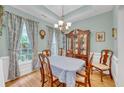 Formal dining room with hardwood floors, light-blue walls and antique furniture at 2851 Curran Pl, Mount Pleasant, SC 29466