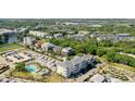 Aerial view of community featuring various architectural styles and a pool at 301 Longshore St # 423, Charleston, SC 29492
