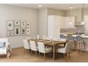 Open concept dining area with kitchen and living room views at 7421 Indigo Palms Way, Johns Island, SC 29455