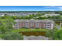 Aerial view of community, showcasing apartment buildings, pool, and landscaping at 1443 Cambridge Lakes Dr, Mount Pleasant, SC 29464