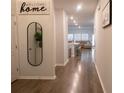 Open concept entryway leading to living room and kitchen at 217 Pink Azalea St, Summerville, SC 29485