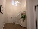 Spacious entryway with staircase and decorative console table at 217 Pink Azalea St, Summerville, SC 29485
