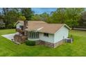 House exterior showcasing back deck, bay window, and landscaping at 225 Cantering Hills Ln, Summerville, SC 29483