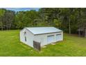 Detached garage with two garage doors and a side door at 225 Cantering Hills Ln, Summerville, SC 29483