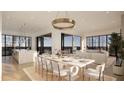 Open concept dining area with marble table and ocean views at 3209 Marshall Blvd, Sullivans Island, SC 29482