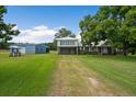 Brick house with a metal roof and a spacious yard at 1121 Heaven Dr, Saint Stephen, SC 29479