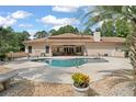 Kidney shaped pool with large patio at 6036 Postell Dr, Ravenel, SC 29470