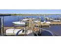 Wooden dock with several boats moored alongside at 2317 Tall Sail Dr # E, Charleston, SC 29414