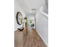 Bright and spacious entryway with wood-look floors and stylish decor at 630 Sweet Ramble Way, Summerville, SC 29486
