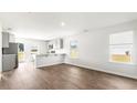 Open living room and kitchen with vinyl plank flooring at 168 River Hill Rd, Goose Creek, SC 29445