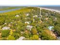 Aerial view of houses near the beach and marsh at 412 E Hudson Ave, Folly Beach, SC 29439