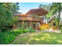 Home with a large deck and spacious backyard at 412 E Hudson Ave, Folly Beach, SC 29439